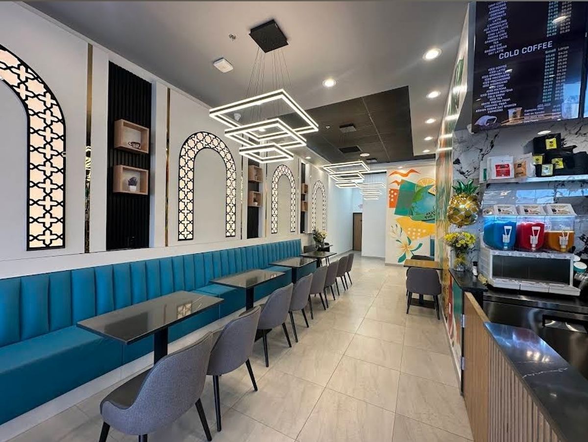 Coffee shop interior with teal booths