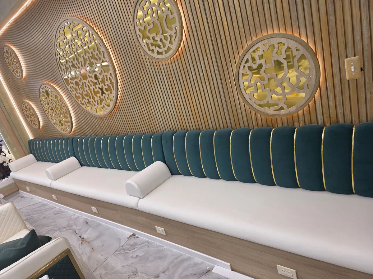 Coffee shop teal and gold booth with wood paneling