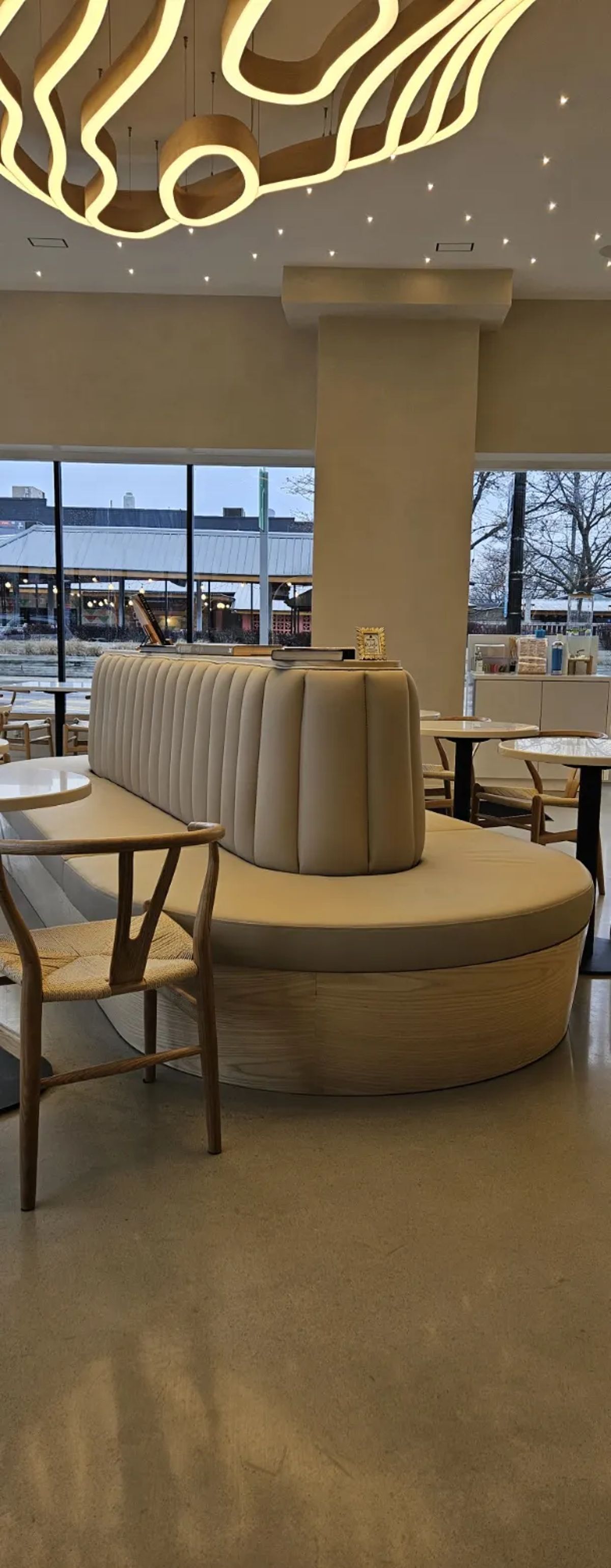 Coffee shop curved tan banquette seating